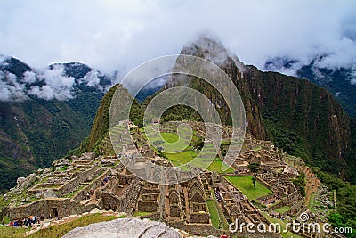 Tourist at Lost City of Machu Picchu - Peru Stock Photo