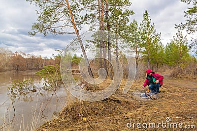 Tourist makes a fire Stock Photo