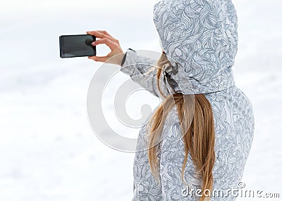 Tourist makes selfies on a high mountainside Stock Photo