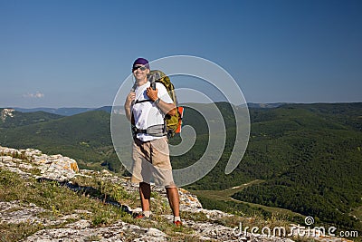 Tourist male looking on the sun and smilling Stock Photo
