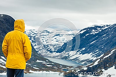 Tourist man standing by Djupvatnet lake, Norway Stock Photo