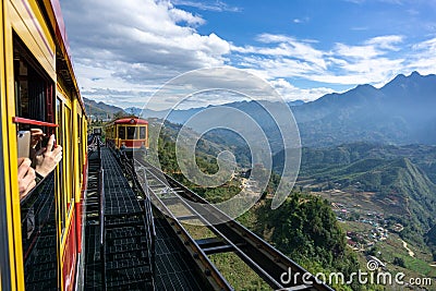Tourist mountain tram, the transporation to Fansipan cable car station in Sapa town, Vietnam, with mountain landscape scene Editorial Stock Photo