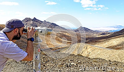 Tourist observing the landscape - Fuerteventura Editorial Stock Photo