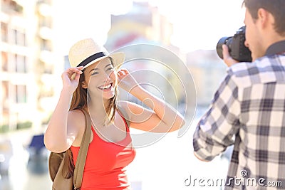 Tourist photographing his friend on vacations Stock Photo