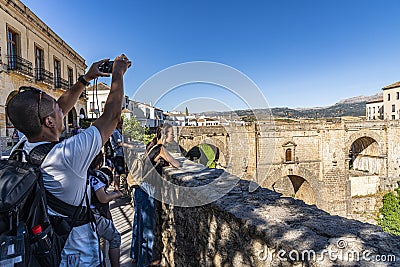 Tourist photographing the New Bridge Ronda Spain Editorial Stock Photo