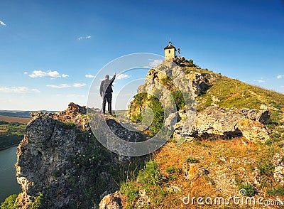 Tourist on the rock. man enjoys the view Editorial Stock Photo