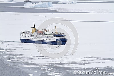 tourist ship breaking ice in the strait of the Antarctic Peninsula Editorial Stock Photo