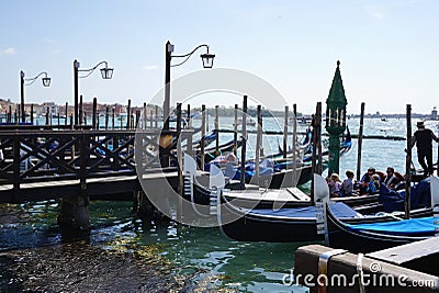 Tourist sitting on the black Gondola at Grand canal in Venice Editorial Stock Photo