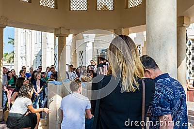 Tourist standing at the ablution taps of Wudu pavilion Jumeirah Mosque, the only mosque in Dubai which is open to the public and Editorial Stock Photo