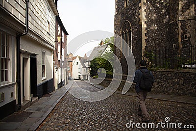 A tourist in the streets of Norwich Editorial Stock Photo