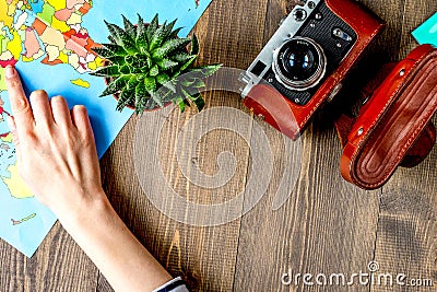 tourist stuff with camera and map on wooden background top view mockup Stock Photo