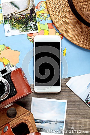 Tourist stuff with camera and map on wooden background top view Stock Photo