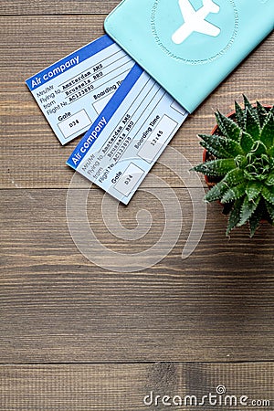 Tourist stuff with passport and tickets on wooden background top view mockup Stock Photo