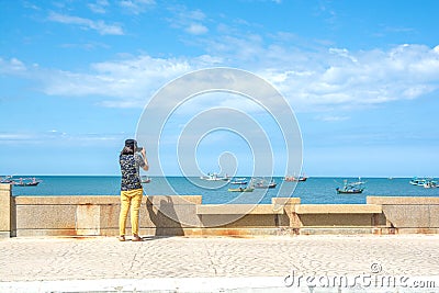 The tourist take picture fishing boats on the sea with blue sky background Editorial Stock Photo