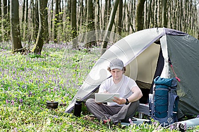 Tourist takes notes in a notebook. Stock Photo