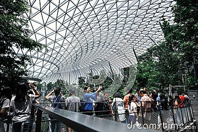 Tourist takes photo at The HSBC Rain Vortex Editorial Stock Photo