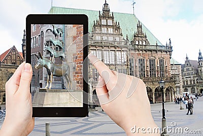 Tourist taking photo of Bremen Town Musicians Editorial Stock Photo