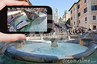 Tourist taking photo fountain on Spanish square Stock Photo