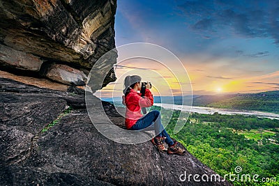 Tourist taking a photo at Pha taem national park in Ubon ratchathani, Thailand Stock Photo