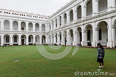 Tourist is taking a photo of Victorian architectural style with center courtyard inside Indian Museum. Editorial Stock Photo