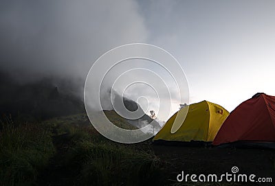 Tourist tents on the foggy mountain Stock Photo