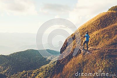 Tourist trail hiking in the forest Traveler Man Relax and crossing the mountain Traveler concept Stock Photo