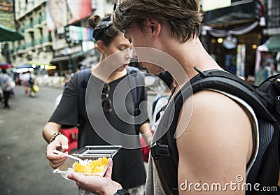 Tourist trying mango with sticky rice Thai dessert Stock Photo