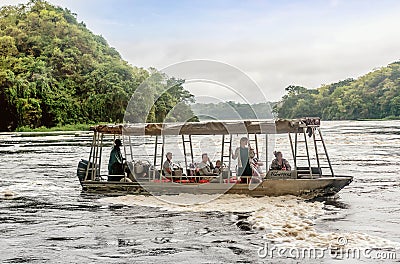 Tourist visit the Murchison Falls on the White Nile river, Ugand Editorial Stock Photo