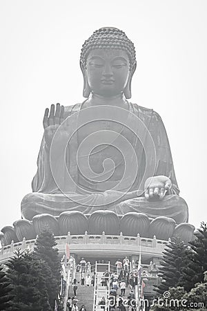 The tourist visited Giant Tian Tan Buddha statue on the peak of the mountain at Po Lin Monastery in Lantau Island, Hong Kong. Editorial Stock Photo
