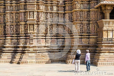 Tourist visiting Khajuraho Hindu temples with a guide Khajuraho India Editorial Stock Photo