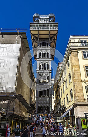 Tourist visiting the Santa Justa Elevator or Elevador do Carmo. Modernist style metal structure elevator. Editorial Stock Photo