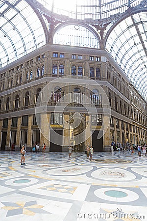 Tourists visiting Galleria Vittorio Emanuele II Stock Photo