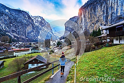 Tourist visiting village of Lauterbrunnen in the Bernese Oberland, Switzerland Stock Photo