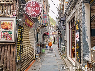 Tourist walking in alley building district of Fenghuang ancient town. Editorial Stock Photo