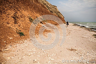 Tourist walking on the beach Editorial Stock Photo