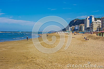 Tourist walking on Pesaro beach in the summer season Editorial Stock Photo