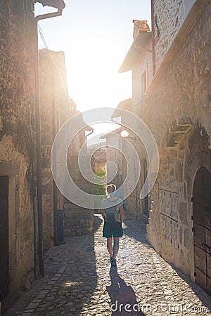 Tourist walking in Santo Stefano di Sessanio medieval village details, historical stone buildings, ancient alley, old city stone Stock Photo