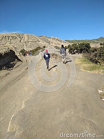 Tourist walking to hiking Mount Bromo Editorial Stock Photo