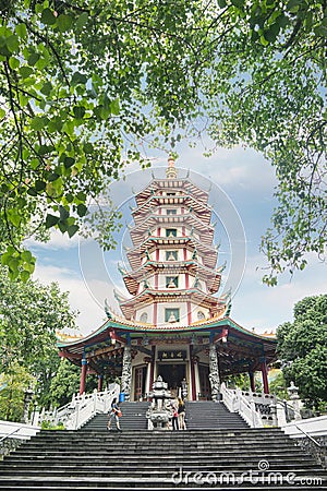 Tourist walking toward Avalokitesvara pagoda Editorial Stock Photo