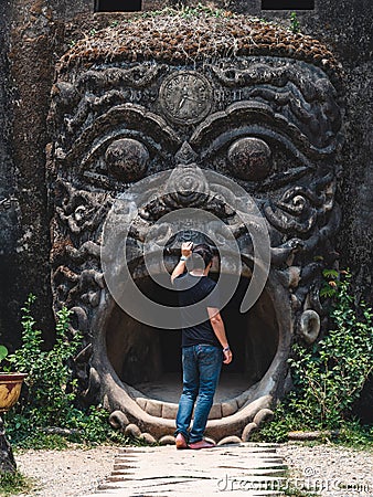 Tourist at Xieng Khuan Buddha Park in Vientiane, Laos Editorial Stock Photo