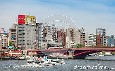 Tourist Water Bus is going under Asakusa red bridge. Editorial Stock Photo