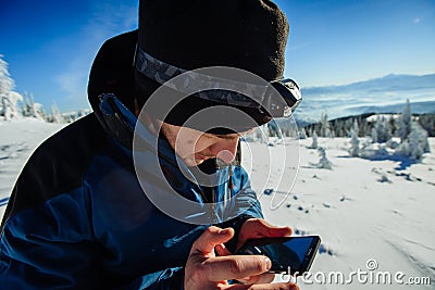 Tourist in winter mountains Stock Photo