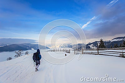 Tourist in winter in the mountains Stock Photo