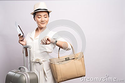 Tourist woman checking time at wrist watch Stock Photo