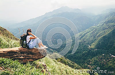 Tourist woman enjoy with beautiful view on mountains in Ella, Sri Lanka, Little Adam Peak Stock Photo