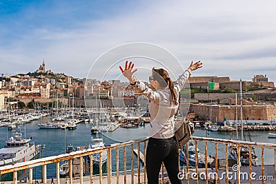 Tourist woman in French historical city Marseille and Mediterranean sea coast. Marseille is the biggest port in France, South Stock Photo