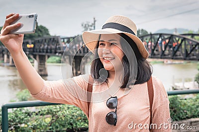 Tourist Woman Having Fun While Sightseeing in Travel Place, Asian Woman Relaxing and Enjoyment While Photographing Landmark of Stock Photo