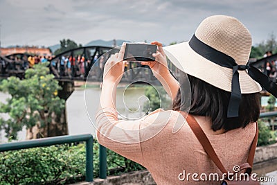 Tourist Woman Having Fun While Sightseeing in Travel Place, Asian Woman Relaxing and Enjoyment While Photographing Landmark of Stock Photo