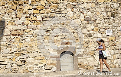 Tourist Woman Is Passing Front Of The Historical Cesme Castle Editorial Stock Photo