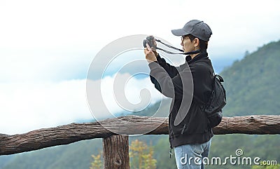 Tourist woman photographer taking nature photo of mountain landscape Thailand Stock Photo